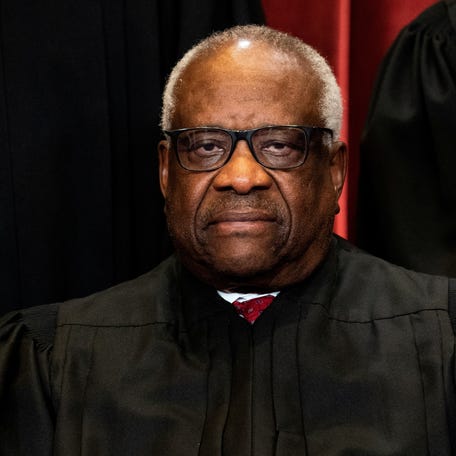 FILE PHOTO: Justice Clarence Thomas poses during a group photo of the justices at the Supreme Court in Washington, U.S., April 23, 2021. Erin Schaff/Pool via REUTERS/File Photo