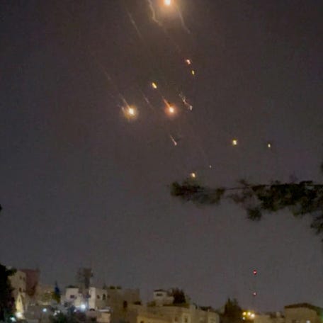 Objects are seen in the sky over Amman after Iran launched drones towards Israel, in Amman, Jordan April 14, 2024, in this screen grab obtained from a social media video. Video Obtained by REUTERS/via REUTERS THIS IMAGE HAS BEEN SUPPLIED BY A THIRD PARTY.