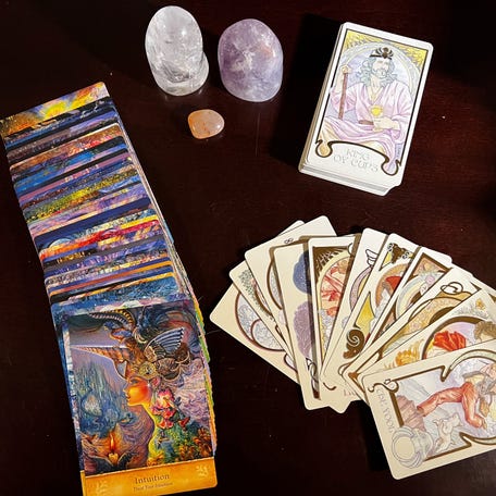 Clockwise from left, oracle cards, crystal quartz, amethyst, rose quartz and tarot cards are some of the ways you can get into mystical and spiritual.
