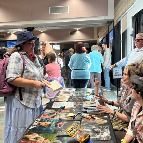 A fan dresses at Kezia, a guest character on three episodes of "Little House on the Prairie," at a fan festival in March. Kezia's character didn't have a home and had mental health struggles, and Melissa Gilbert says the way the show portrayed social issues kept the show relevant.