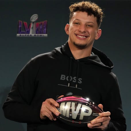 Chiefs quarterback Patrick Mahomes poses with the Super Bowl MVP trophy after the Chiefs' victory over the 49ers in Super Bowl 58 in Las Vegas.