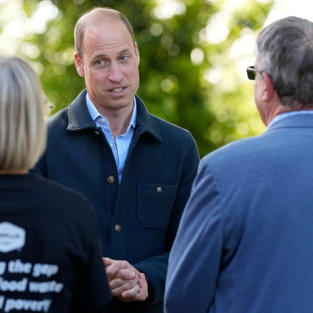 Prince William, Prince of Wales is greeted as he arrives for a visit to Surplus to Supper, in Sunbury-on-Thames on April 18, 2024, in Surrey, England.