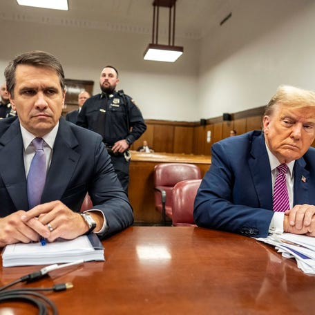 Former U.S. President Donald Trump and lawyer Todd Blanche sit in the Manhattan Criminal Court before the start of his trial for allegedly covering up hush money payments in New York City, U.S., April 19, 2024.