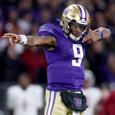 Michael Penix Jr. #9 of the Washington Huskies reacts after a first down against the Washington State Cougars during the fourth quarter at Husky Stadium on November 25, 2023 in Seattle, Washington.