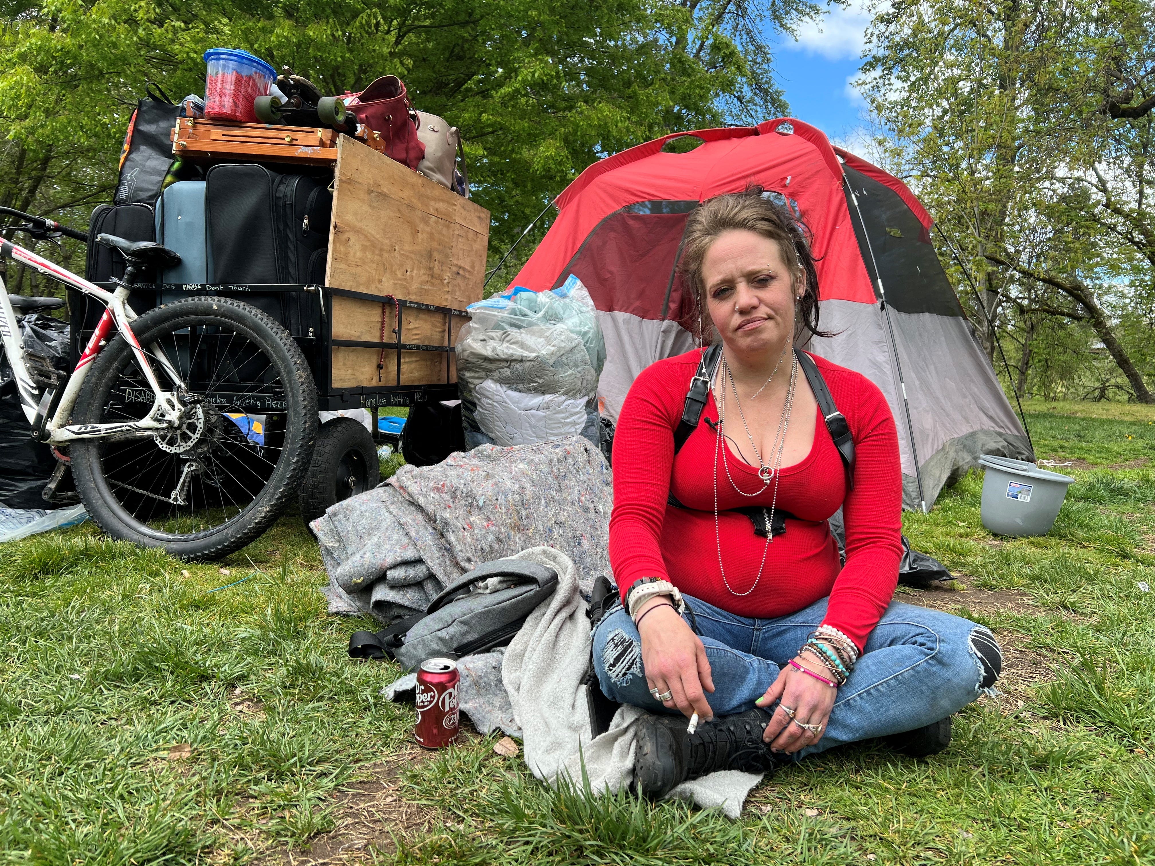 Amber Rockwell takes a break from packing to smoke a cigarette, in Grants Pass, Oregon, U.S., April 17, 2024. REUTERS/Deborah Bloom