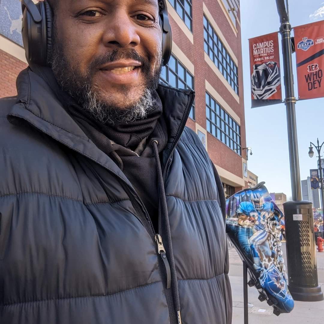 Ed Cliett, a downtown resident and first-time Lions season ticketholder last season, felt right at home at Ford Field next to the DECLEATED artwork created by Kenyada Kelsaw.