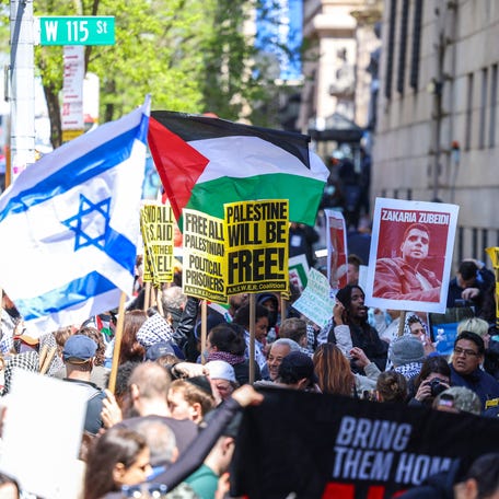 Pro-Palestinian and Pro-Israel protesters face off in front of the entrance of Columbia University in New York on April 22, 2024.