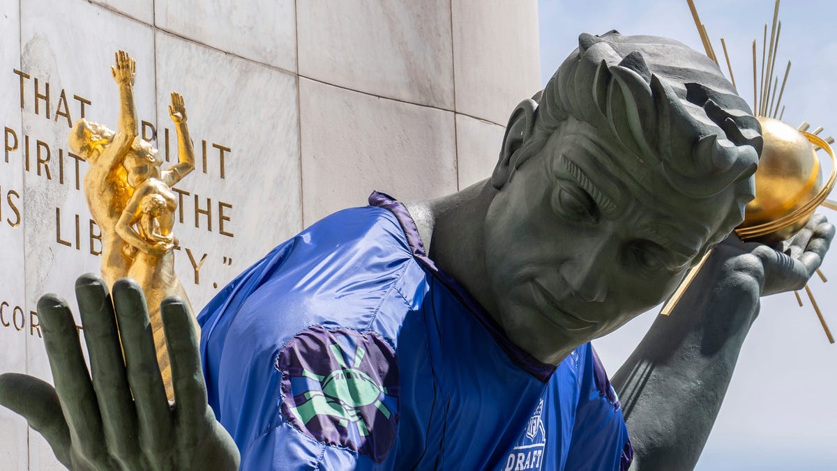 The Spirit of Detroit statue sports a jersey for the NFL draft in downtown Detroit on April 16, 2024.