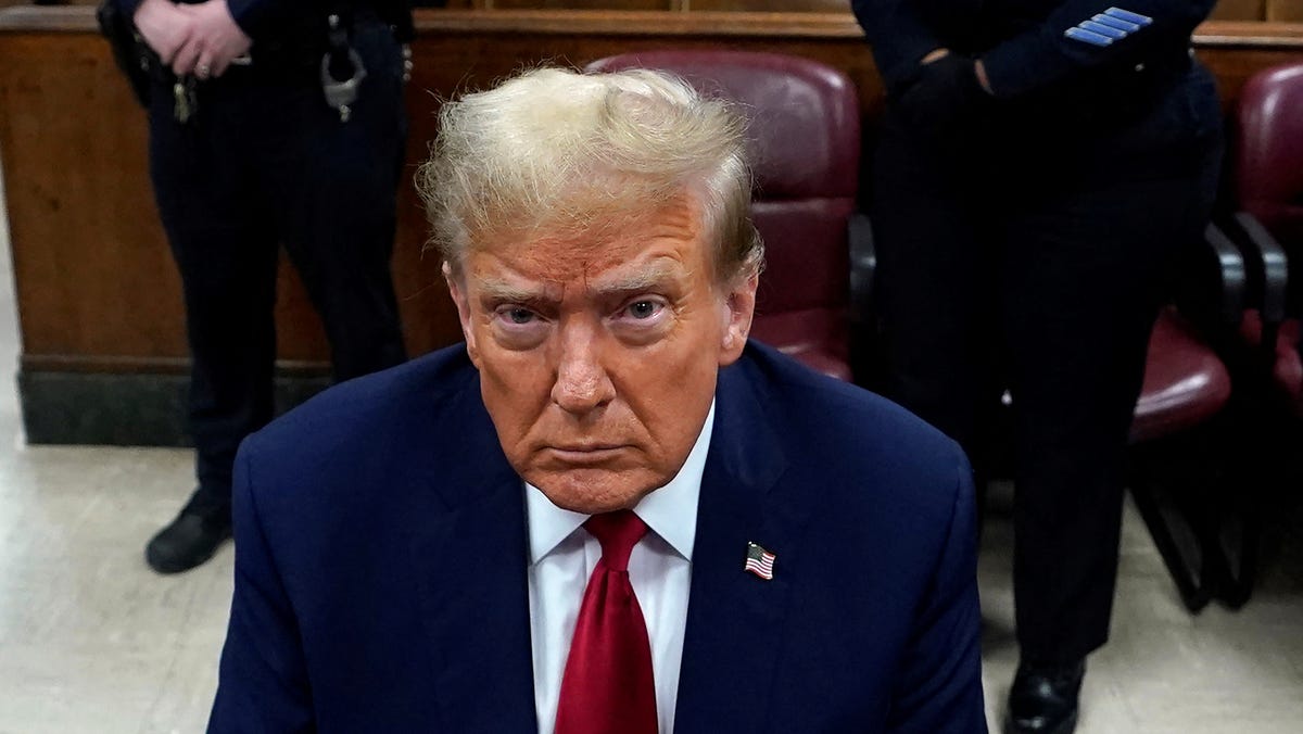 Former US President Donald Trump attends his trial for allegedly covering up hush money payments linked to extramarital affairs, at Manhattan Criminal Court in New York City, U.S., April 23, 2024.