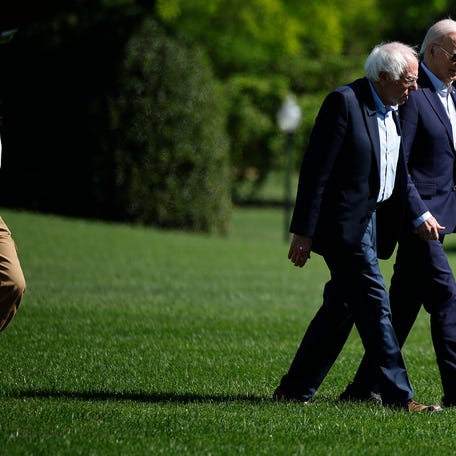 WASHINGTON, DC - APRIL 22: U.S. President Joe Biden (R) and Sen. Bernie Sanders (I-VT) are joined by Rep. Alexandria Ocasio-Cortez (D-NY) as they walk across the South Lawn after returning to the White House on board the Marine One presidential helicopter on April 22, 2024 in Washington, DC. Biden, Sanders, Ocasio-Cortez and Sen. Ed Markey (D-MA) returned to the White House following an Earth Day event in Virginia. (Photo by Chip Somodevilla/Getty Images)