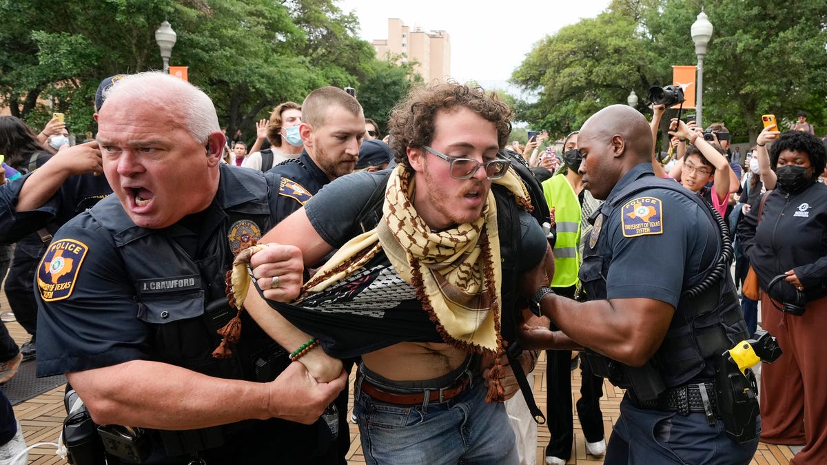 University of Texas police officers arrest UT student Ammer Qaddumi at a pro-Palestinian protest at UT Wednesday April 24, 2024.