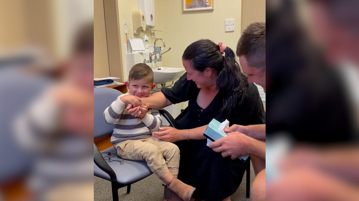 Little boy finally hearing his parents' voices
