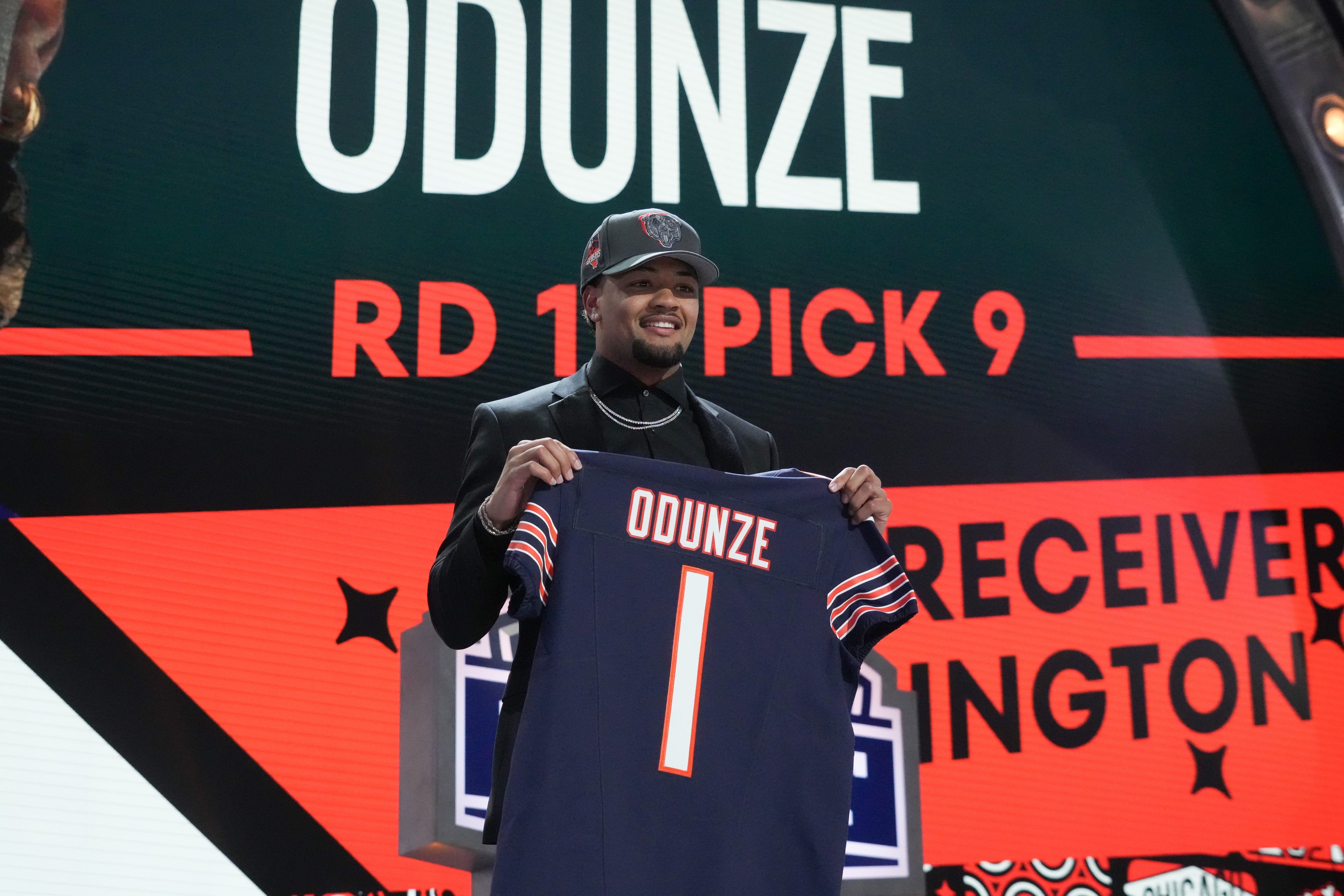 Apr 25, 2024; Detroit, MI, USA; Washington Huskies wide receiver Rome Odunze poses after being selected by the Chicago Bears as the No. 8 pick in the first round of the 2024 NFL Draft at Campus Martius Park and Hart Plaza. Mandatory Credit: Kirby Lee-USA TODAY Sports