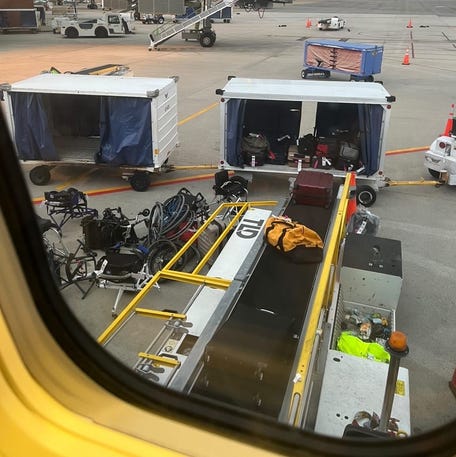 Wheelchairs being loaded at Denver Airport.