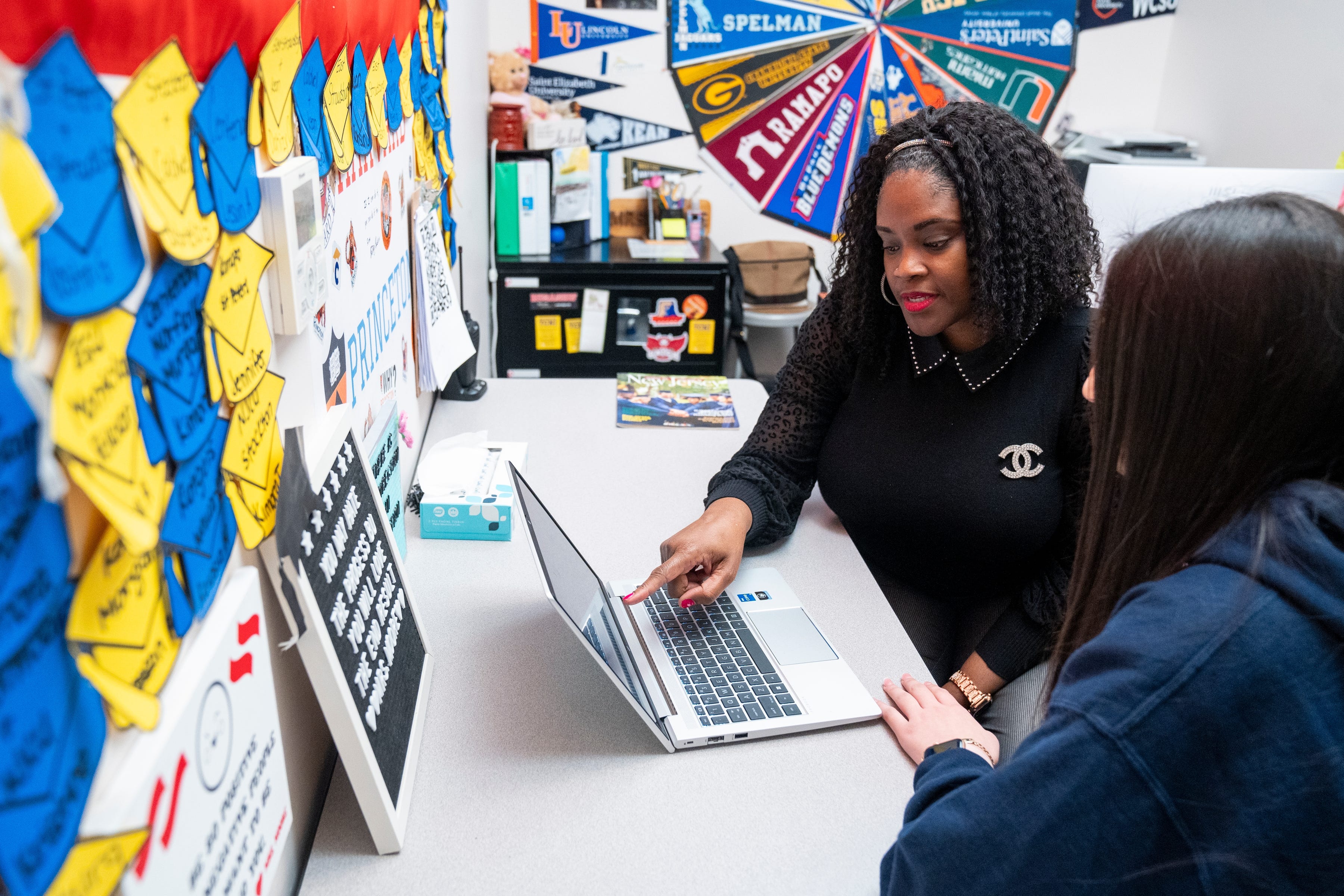Director of Counseling Halima Moore works with Ashly Callejas at the High school campus of College Achieve Central Charter School in North Plainfield, N.J.