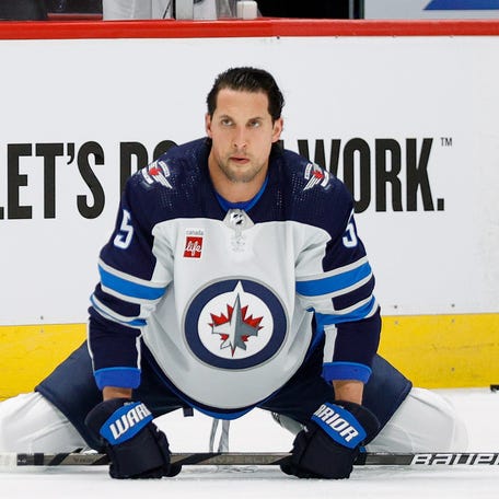 Winnipeg Jets defenseman Brenden Dillon stretches before Game 3 against the Colorado Avalanche at Ball Arena.