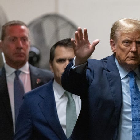 April 26, 2024; New York, New York; Former President Donald Trump returns from a break at Manhattan criminal court. Trump faces 34 felony counts of falsifying business records as part of an alleged scheme to silence claims of extramarital sexual encounters during his 2016 presidential campaign. Mandatory Credit: Jeenah Moon/Pool via USA TODAY NETWORK