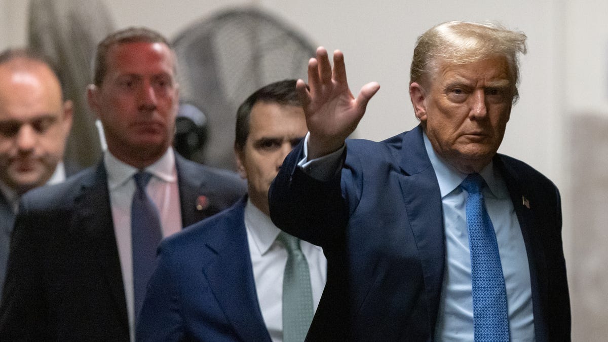 April 26, 2024; New York, New York; Former President Donald Trump returns from a break at Manhattan criminal court. Trump faces 34 felony counts of falsifying business records as part of an alleged scheme to silence claims of extramarital sexual encounters during his 2016 presidential campaign. Mandatory Credit: Jeenah Moon/Pool via USA TODAY NETWORK