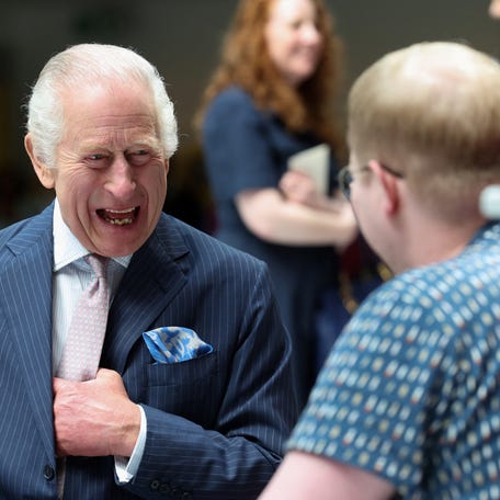 King Charles III meets with patient Jasper Keech during a visit at the University College Hospital Macmillan Cancer Centre on April 30, 2024 in London, England.