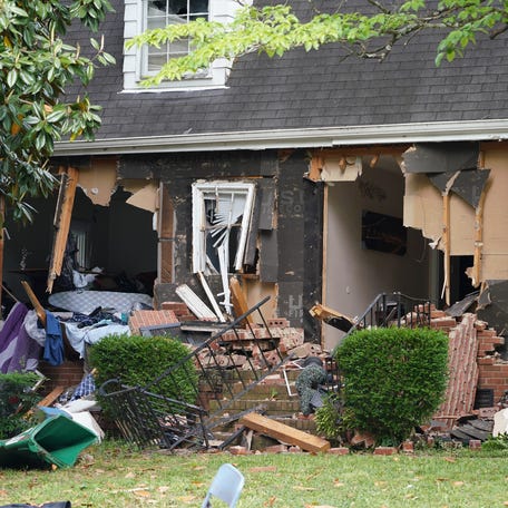 Authorities used a battering ram attached to an armored vehicle to tear off the front of a Charlotte, North Carolina, home that was the site of a shooting incident in which four law enforcement officers were killed while attempting to serve a warrant on April 29.