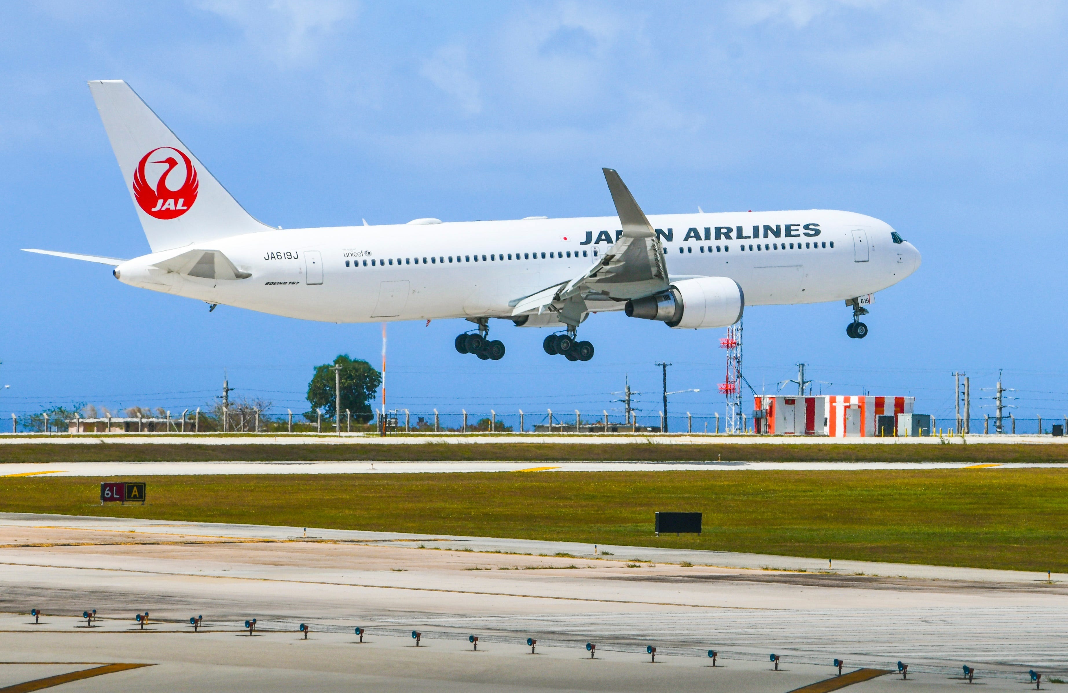 Japan Airlines Flight 941, arriving from Narita, Japan, prepares to land at the A.B. Won Pat International Airport in Tamuning on Thursday. March 19, 2020. The airline on April 23, 2024 grounded a flight because it reported a pilot drank too much before a morning flight.