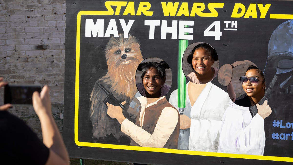 Some "Star Wars" fans have their photo taken in 2022 during a "Star Wars" Festival in Panama City, Fla. during a May the 4th celebration.