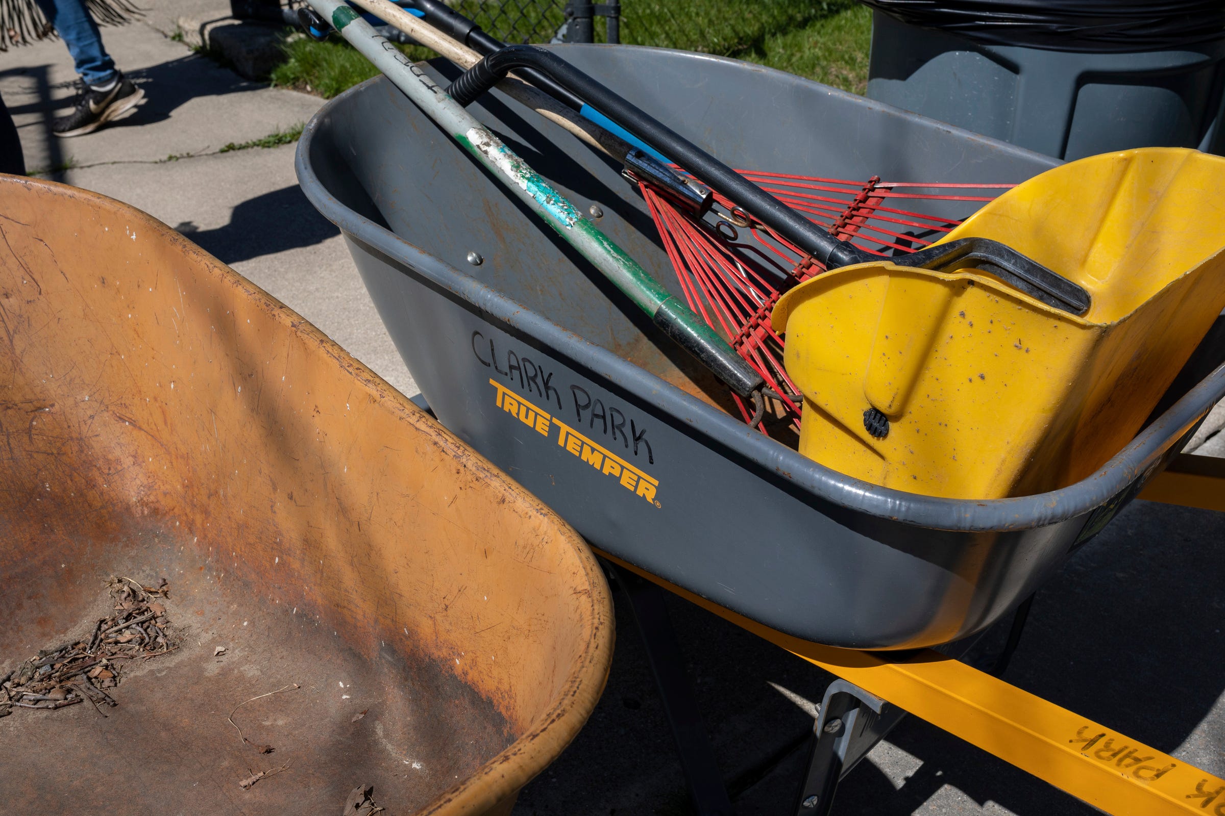 Two wheelbarrows sit side by side at Clark Park in southwest Detroit on Saturday, April 13, 2024.