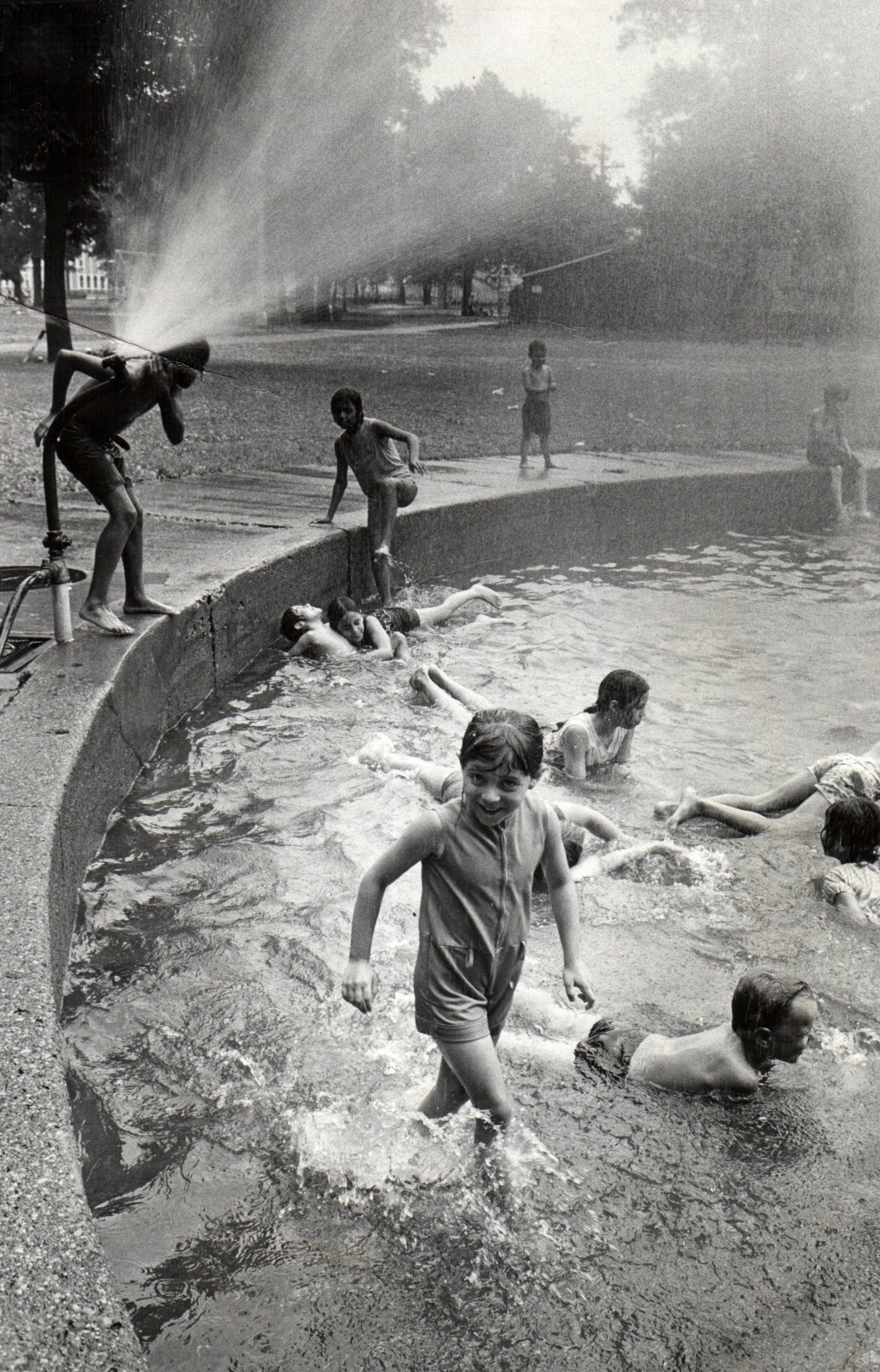 Children cool off at the wading pool at Clark Park in southwest Detroit in July 1973.