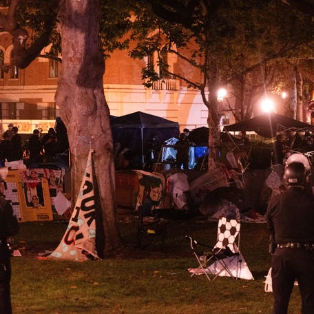 Los Angeles Police Department officers dismantle the pro-Palestinian encampment on Alumni Park at the University of Southern California (USC) in Los Angeles, California, on May 5, 2024. Pro-Palestinian protests that have rocked US campuses for weeks were more muted Friday after a series of clashes with police, mass arrests and a stern White House directive to restore order. (Photo by Jason Goode / AFP via Getty Images)
