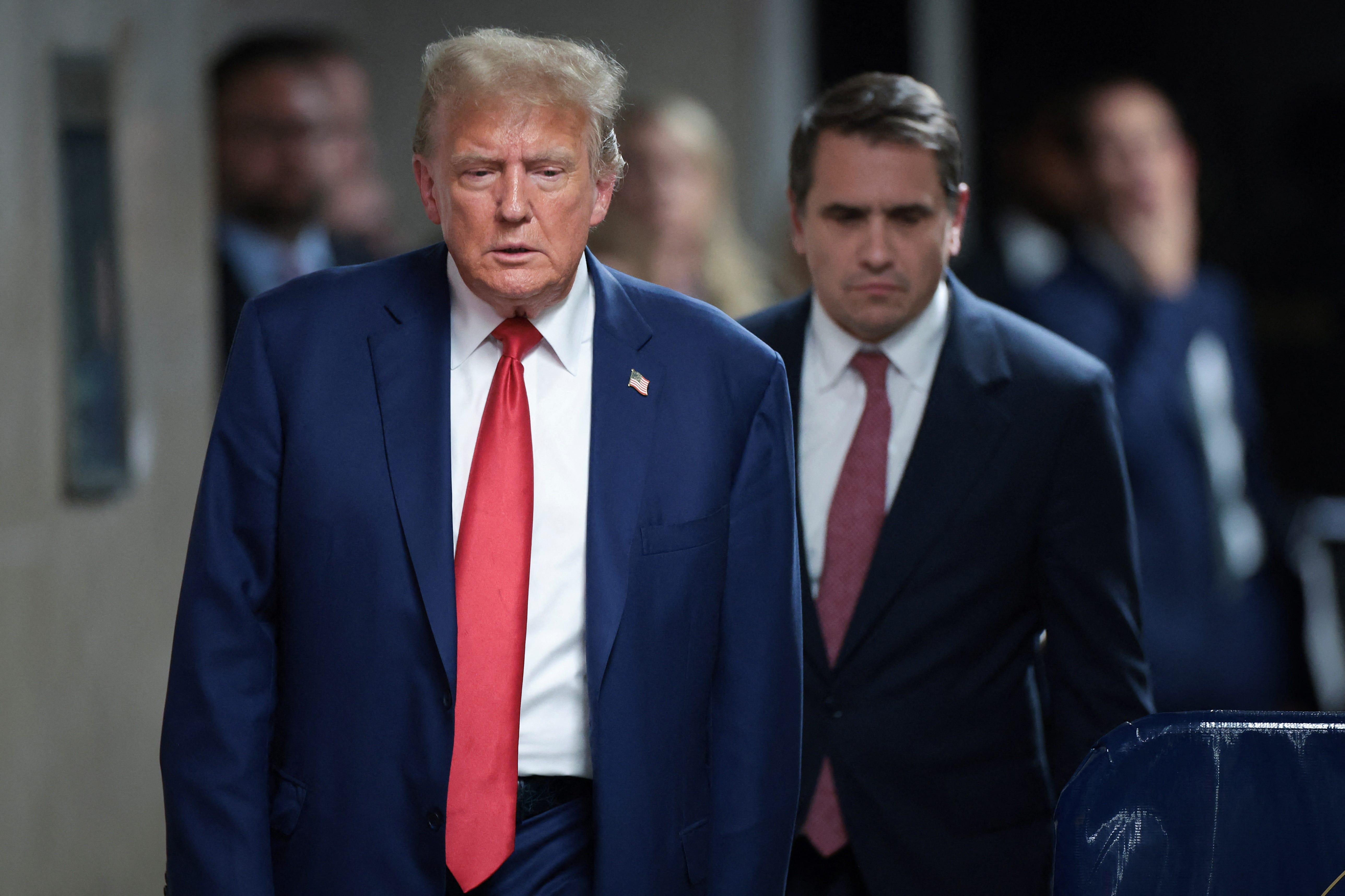 Former U.S. President Donald Trump walks at the end of the day amid his trial for allegedly covering up a hush money payment at Manhattan Criminal Court on May 6, 2024 in New York City. Trump has been charged with 34 counts of falsifying business records, which prosecutors say was an effort to hide a potential sex scandal, both before and after the 2016 presidential election. Trump is the first former U.S.   president to face trial on criminal charges.  Win McNamee/Pool via REUTERS