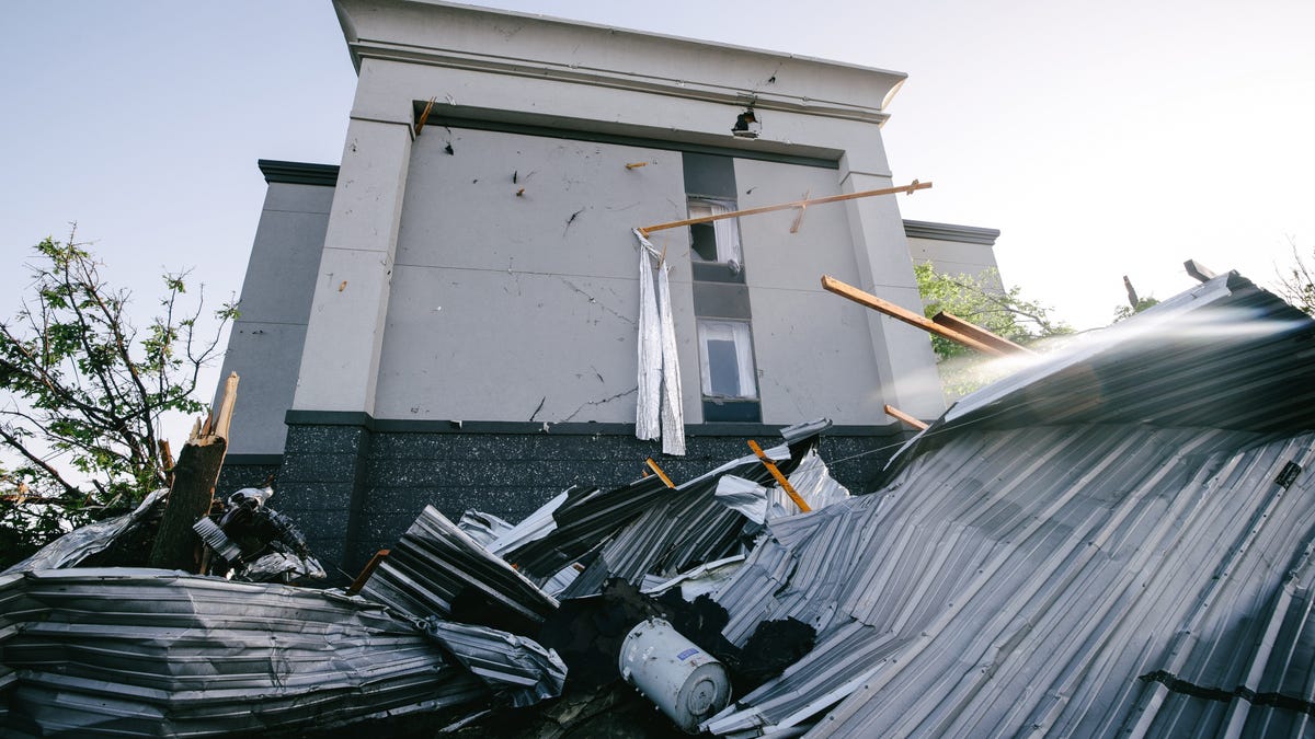 The Hampton Inn in Bartlesville, Oklahoma, was damaged during severe weather on the May 6, 2024, in the area. The building, shown on May 7 with roof debris stuck in the side, lost much of its roof in a possible tornado Monday night.