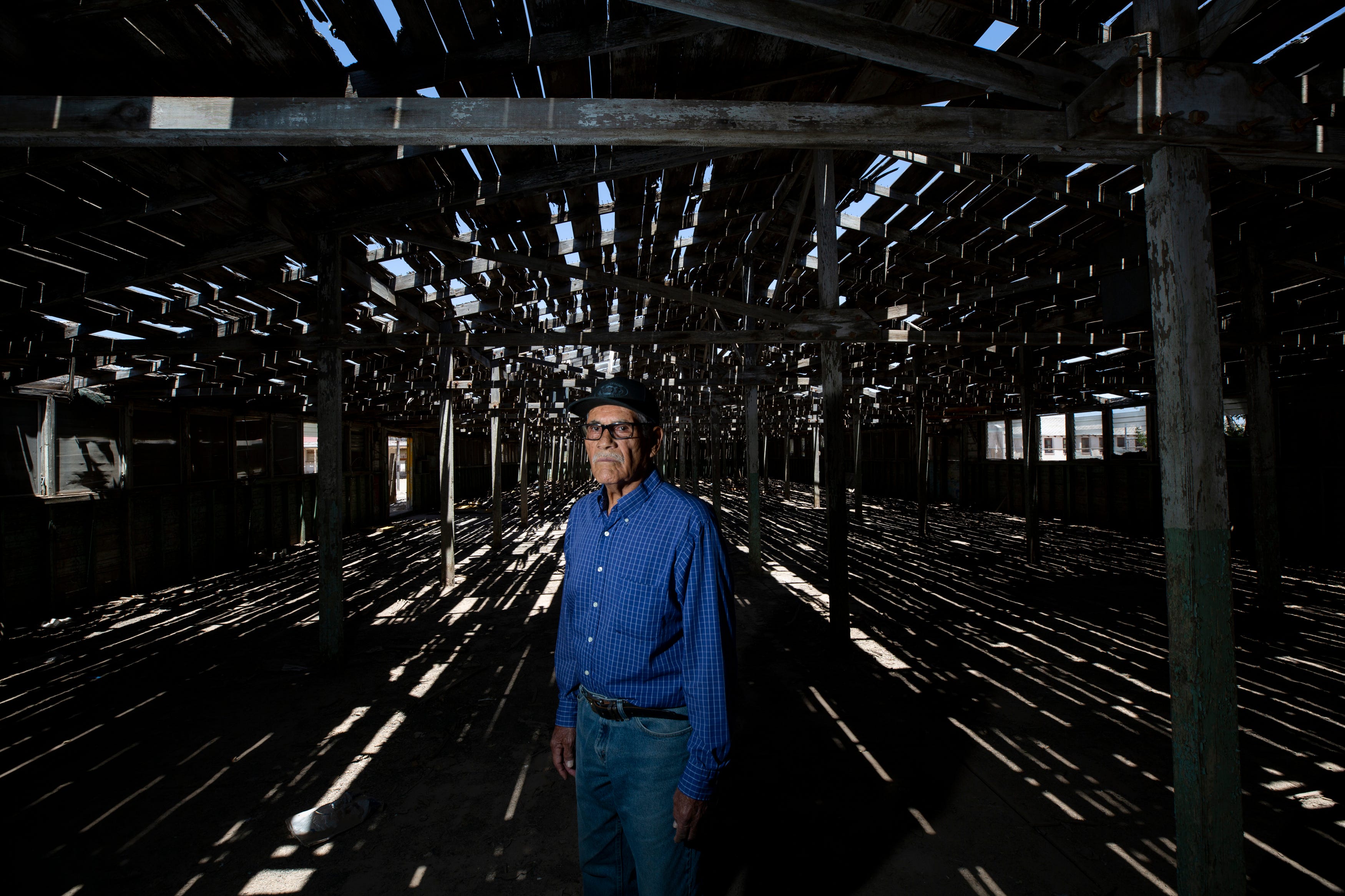 Jose Rodriguez is photographed inside the 'Wooden Building', the building where Mexican men were selected and processed for agricultural jobs in the US during the Bracero Program at The Rio Vista Farm on