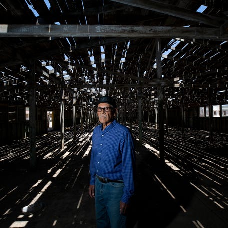 Jose Rodriguez is photographed inside the 'Wooden Building', the building where Mexican men were selected and processed for agricultural jobs in the US during the Bracero Program at The Rio Vista Farm on