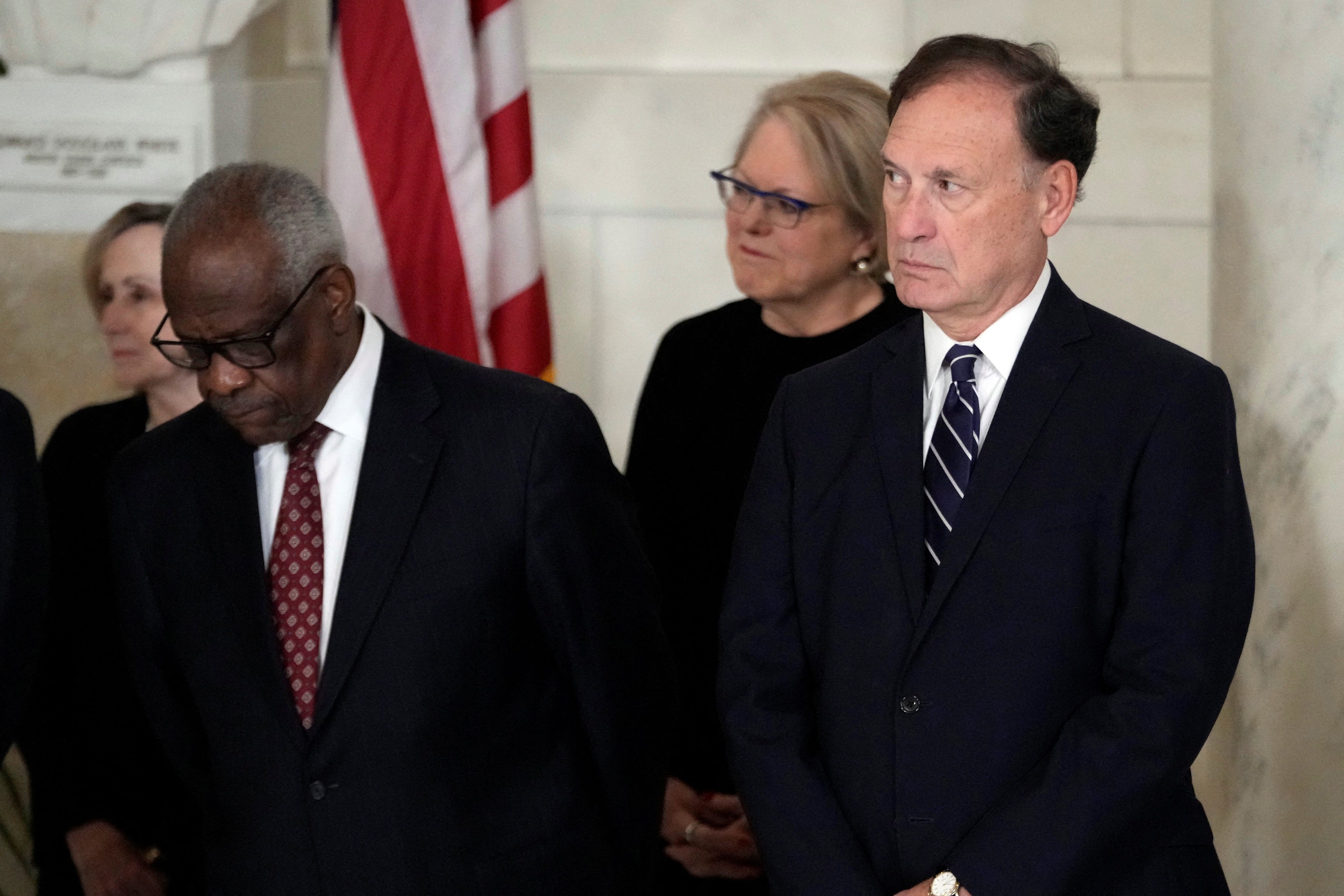 Supreme Court Justice Clarence Thomas and Justice Samuel Alito attend a private ceremony for retired Supreme Court Justice Sandra Day O'Connor before public repose in the Great Hall at the Supreme Court in Washington, Monday, Dec. 18, 2023. O'Connor, an Arizona native and the first woman to serve on the nation's highest court, died Dec. 1 at age 93.  Jacquelyn Martin/Pool via REUTERS