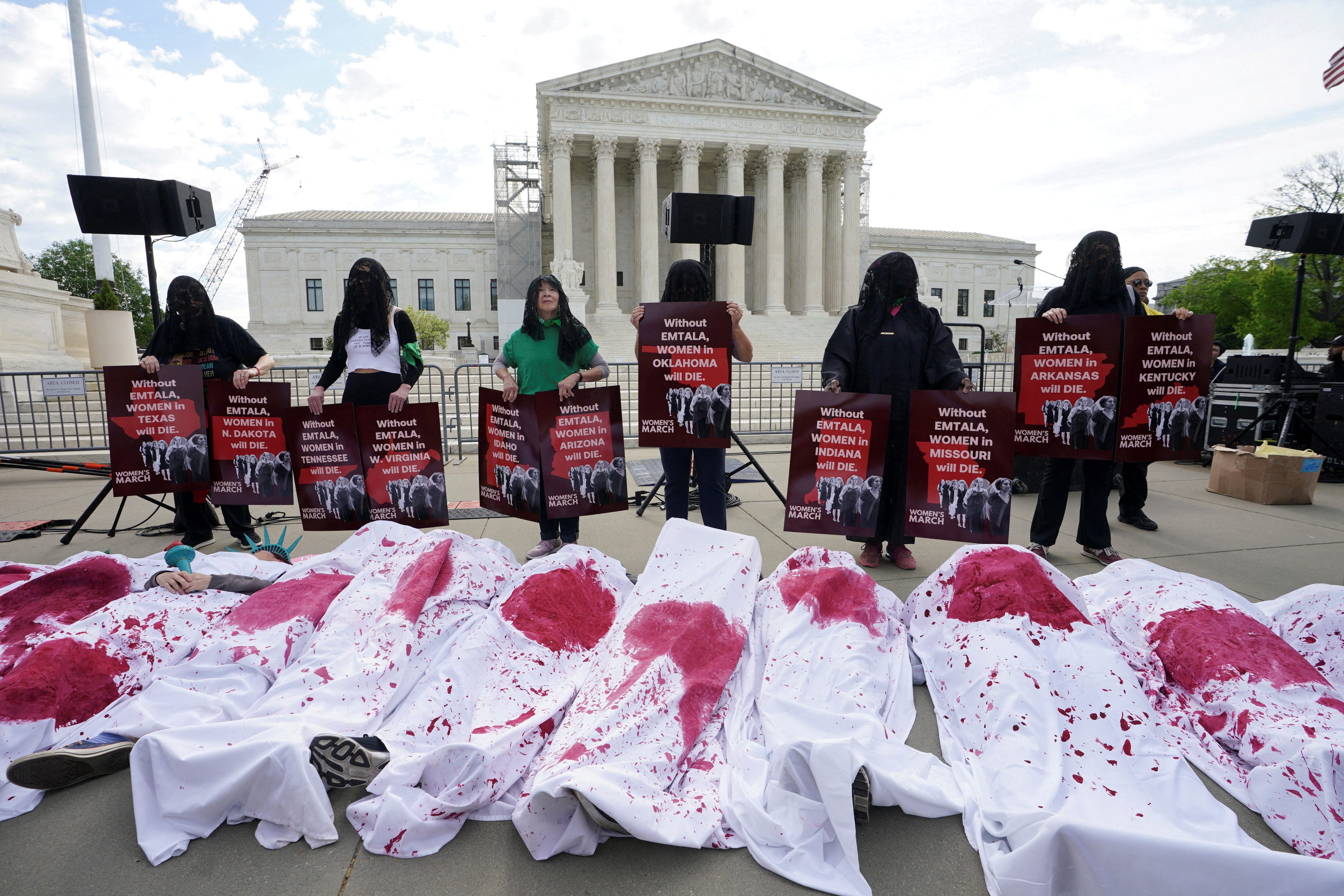 Abortion rights supporters stage a "die-in" protest in support of reproductive rights and emergency abortion care, on the day the Supreme Court justices hear oral arguments over the legality of Idaho's Republican-backed, near-total abortion ban in medical-emergency situations, in Washington, U.S., April 24, 2024. REUTERS/Kevin Lamarque