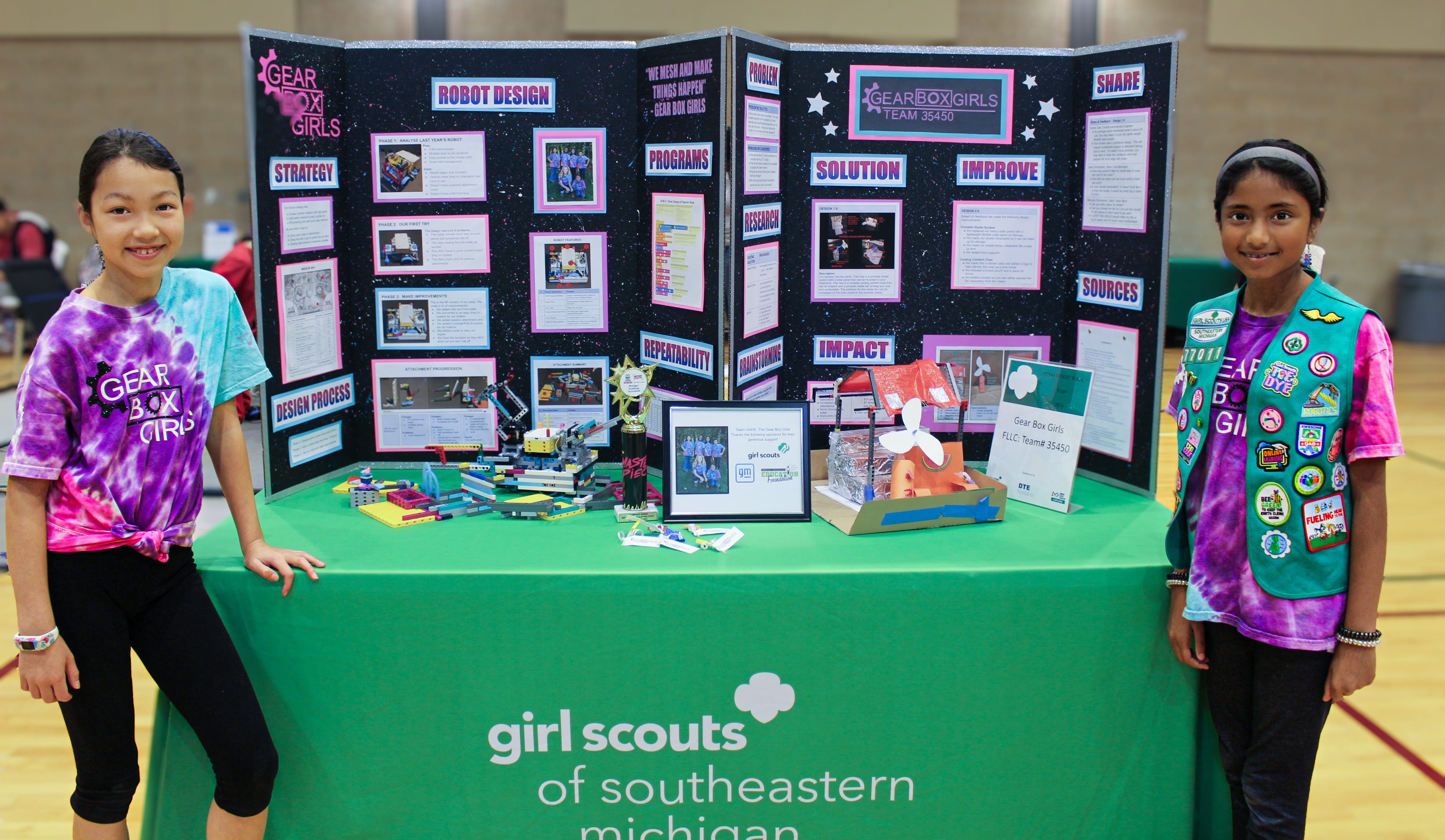 Katie Gee (left) and Navika Anil, representing the FIRST LEGO League Challenge Team 35450, also known as the "Gear Box Girls," demonstrate the important principles that drive a robotics team during a May 4 Robotics Expo presented by the Girls Scouts of Southeastern Michigan and FIRST (For Inspiration and Recognition of Science and Techology) Michigan.