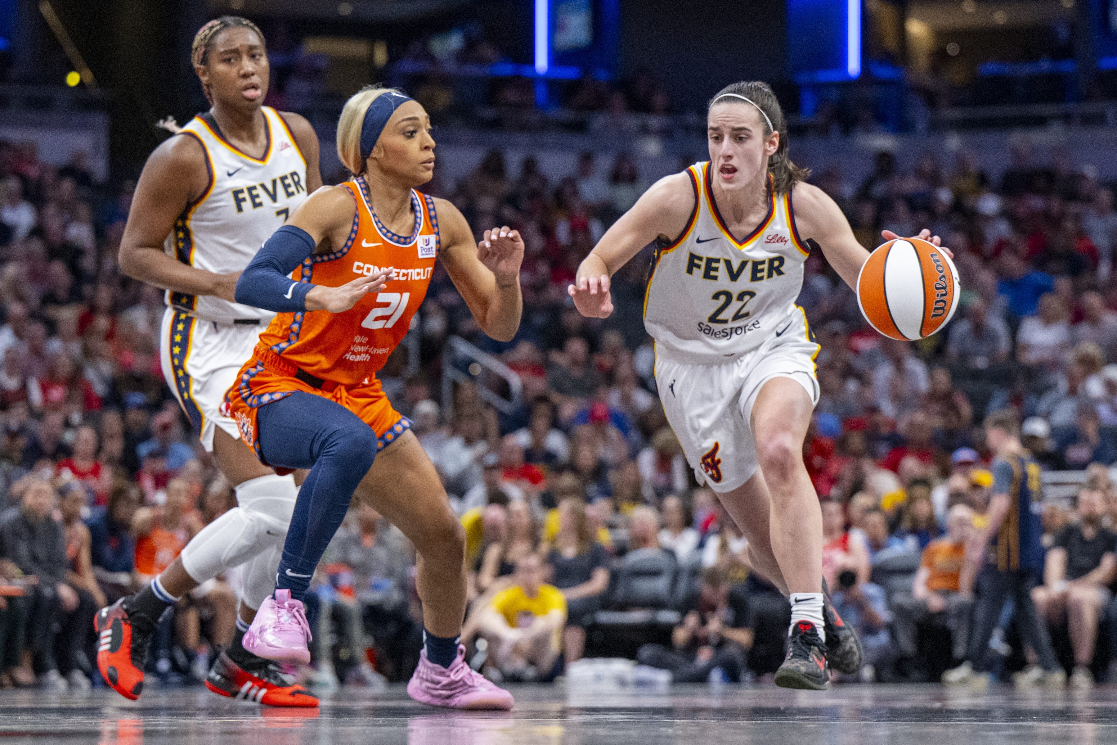 Indiana Fever guard Caitlin Clark dribbles upcourt in a May 20 game against the Connecticut Sun.