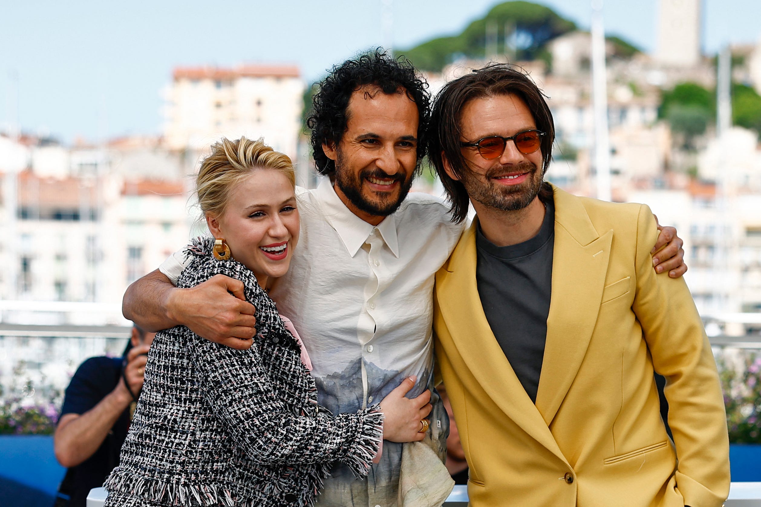 (From L) Bulgarian actress Maria Bakalova, Iranian-Danish director Ali Abbasi and Romanian-US actor Sebastian Stan pose during a photocall for the film "The Apprentice" at the 77th edition of the Cannes Film Festival in Cannes, southern France, on May 21, 2024. (Photo by Sameer Al-Doumy / AFP) (Photo by SAMEER AL-DOUMY/AFP via Getty Images) ORG XMIT: 776144707 ORIG FILE ID: 2153411094