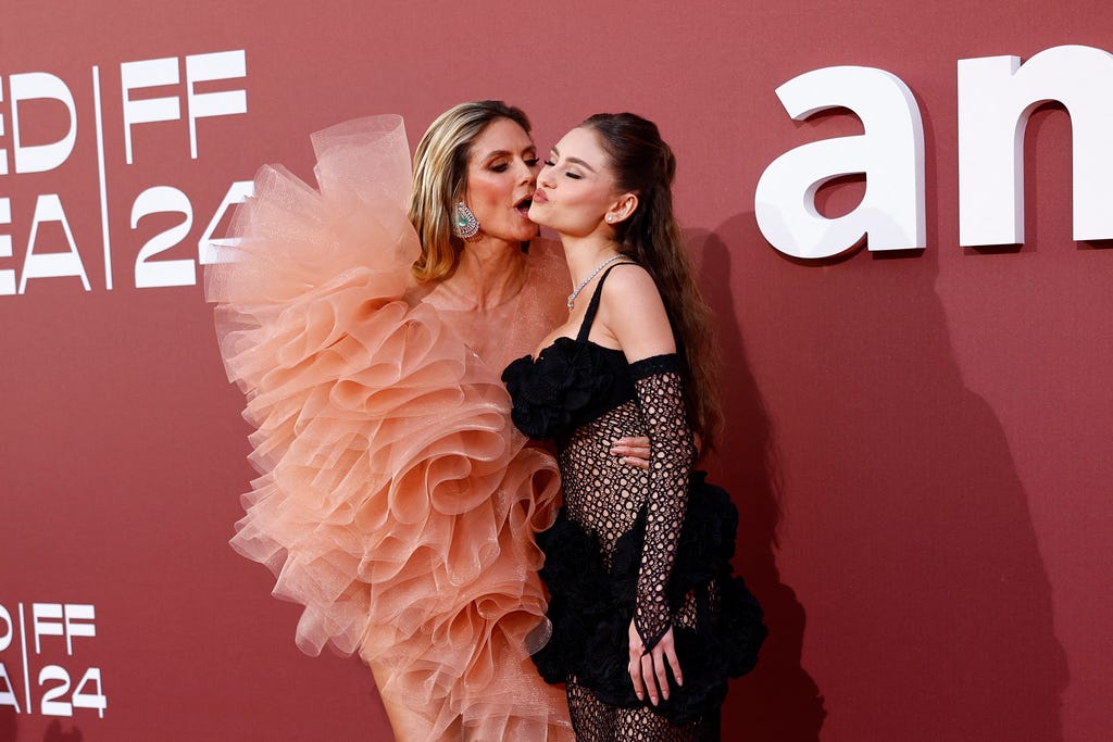 (From L) German model Heidi Klum and her daughter Leni Klum arrive to attend the annual amfAR Cinema Against AIDS Cannes Gala at the Hotel du Cap-Eden-Roc in Cap d'Antibes, southern France, on the sidelines of the 77th Cannes Film Festival, on May 23, 2024. (Photo by Sameer Al-Doumy / AFP) (Photo by SAMEER AL-DOUMY/AFP via Getty Images) ORIG FILE ID: 2153712924
