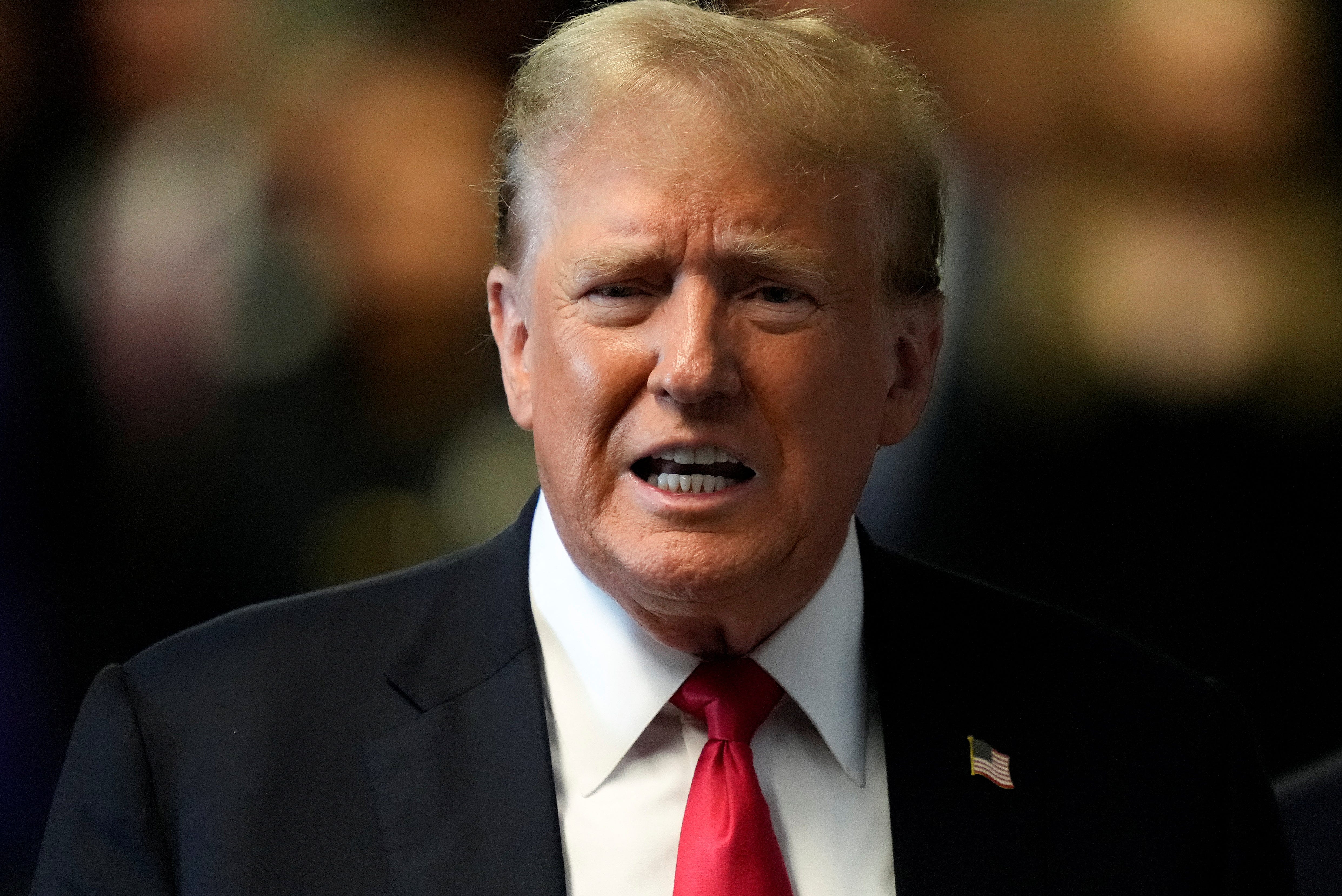 Former President Donald Trump speaks to members of the media upon arriving at Manhattan Criminal Court, in New York on May 28, 2024.