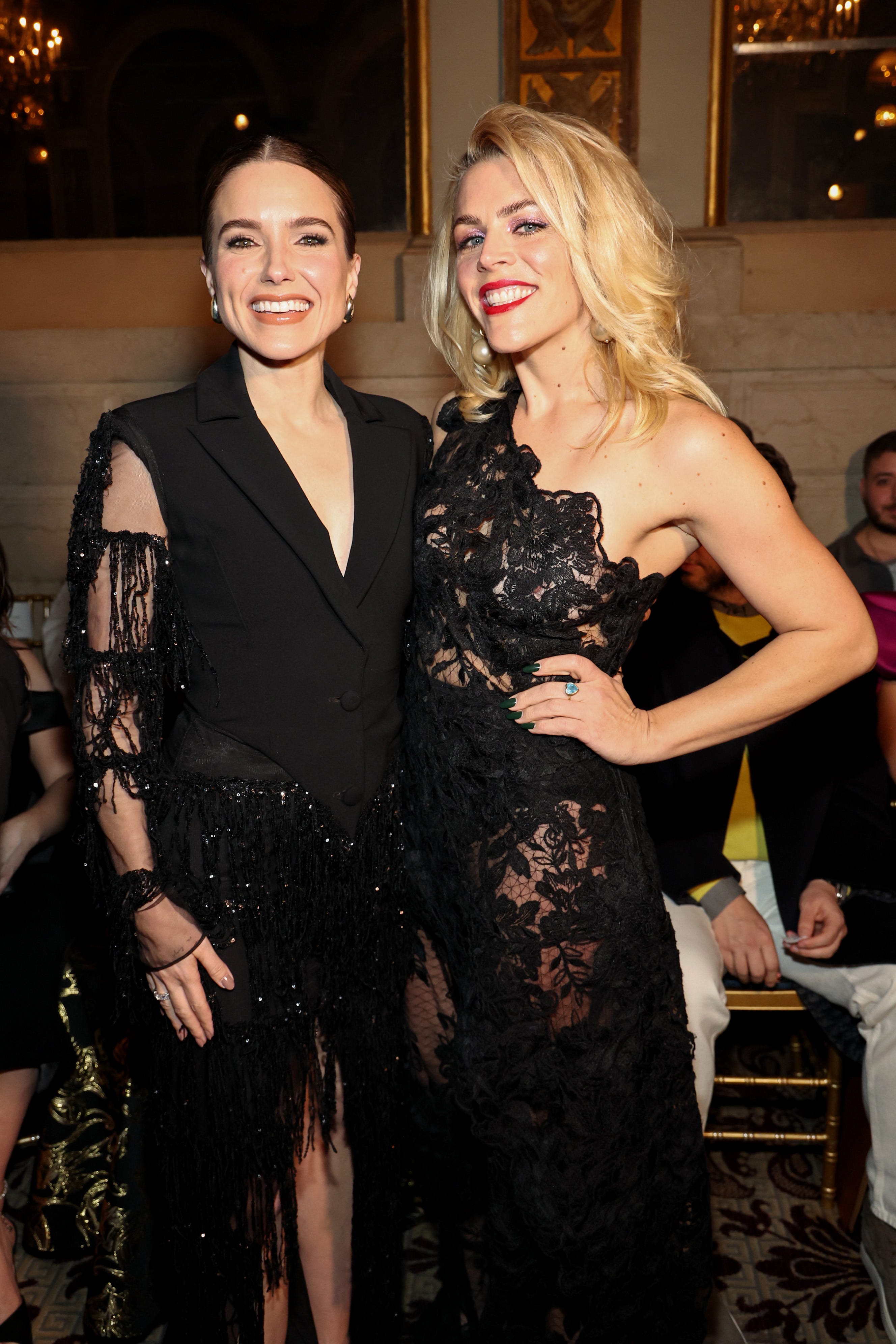 (L-R) Sophia Bush and Busy Philipps attend the Christian Siriano Fall/Winter 2024 Fashion Show at The Plaza Hotel on Feb. 8, 2024 in New York City.