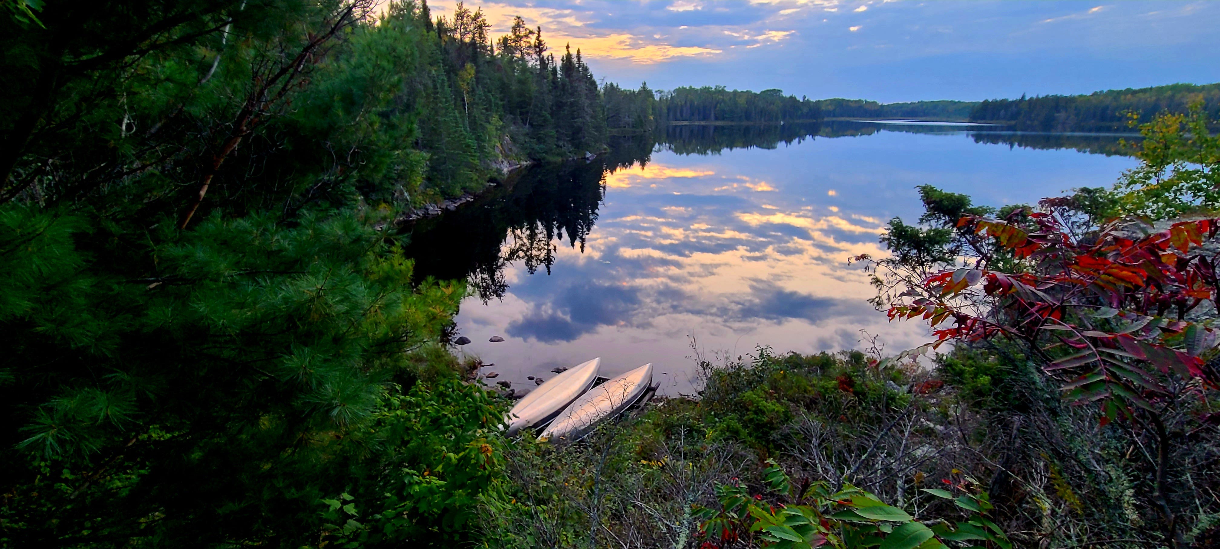 Canoes sit on the edge of Ek Lake in Voyageurs National Park.