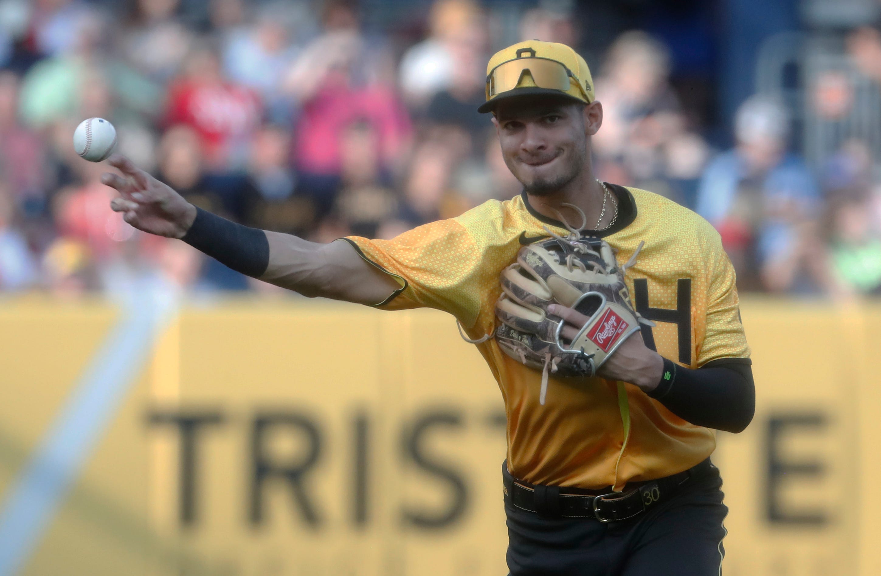Pirates shortstop Tucupita Marcano (30) throws to first base during a game against the Giants at PNC Park in Pittsburgh on July 14, 2023.