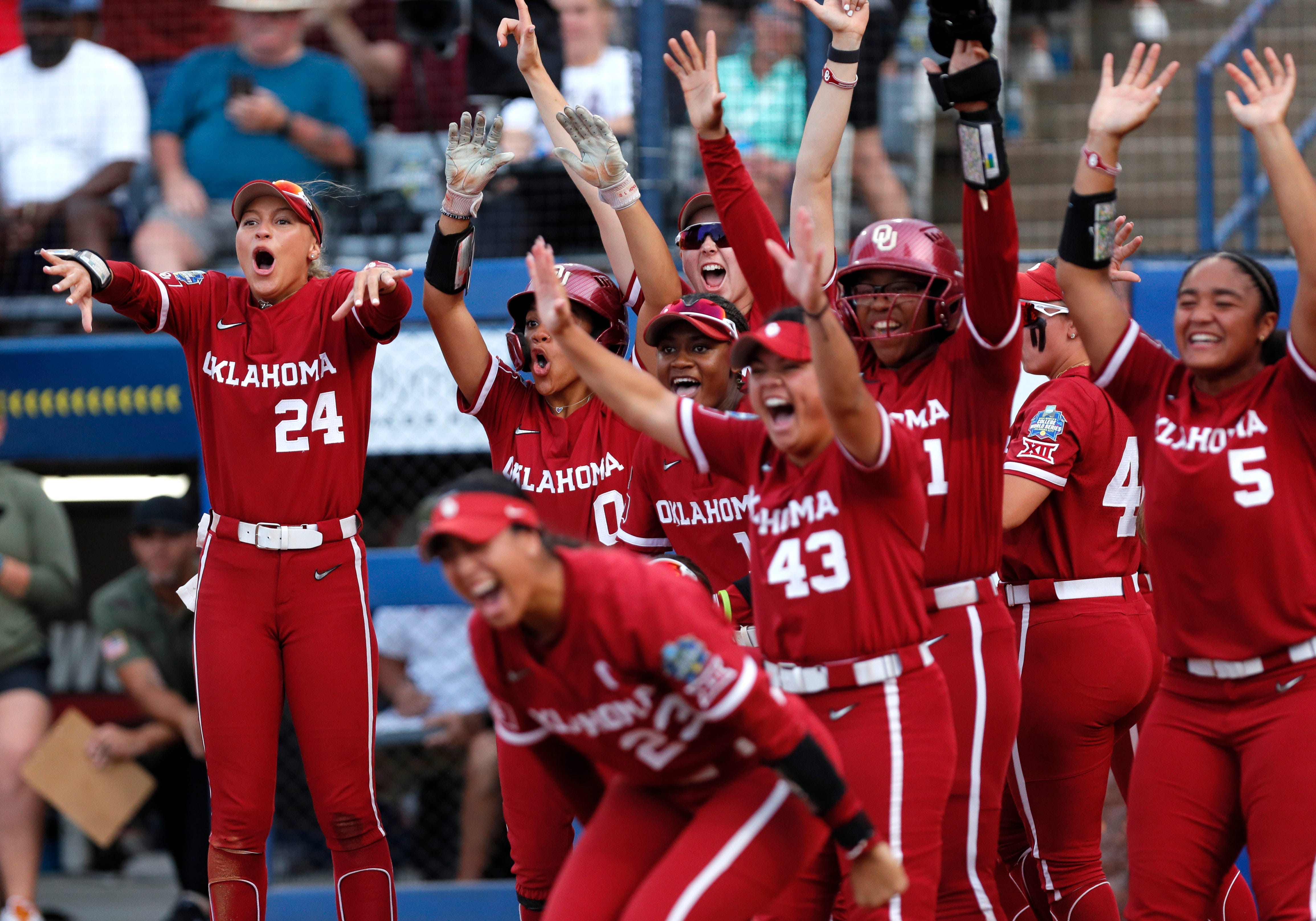 The Oklahoma Sooners celebrate Kasidi Pickering's second-inning home run.