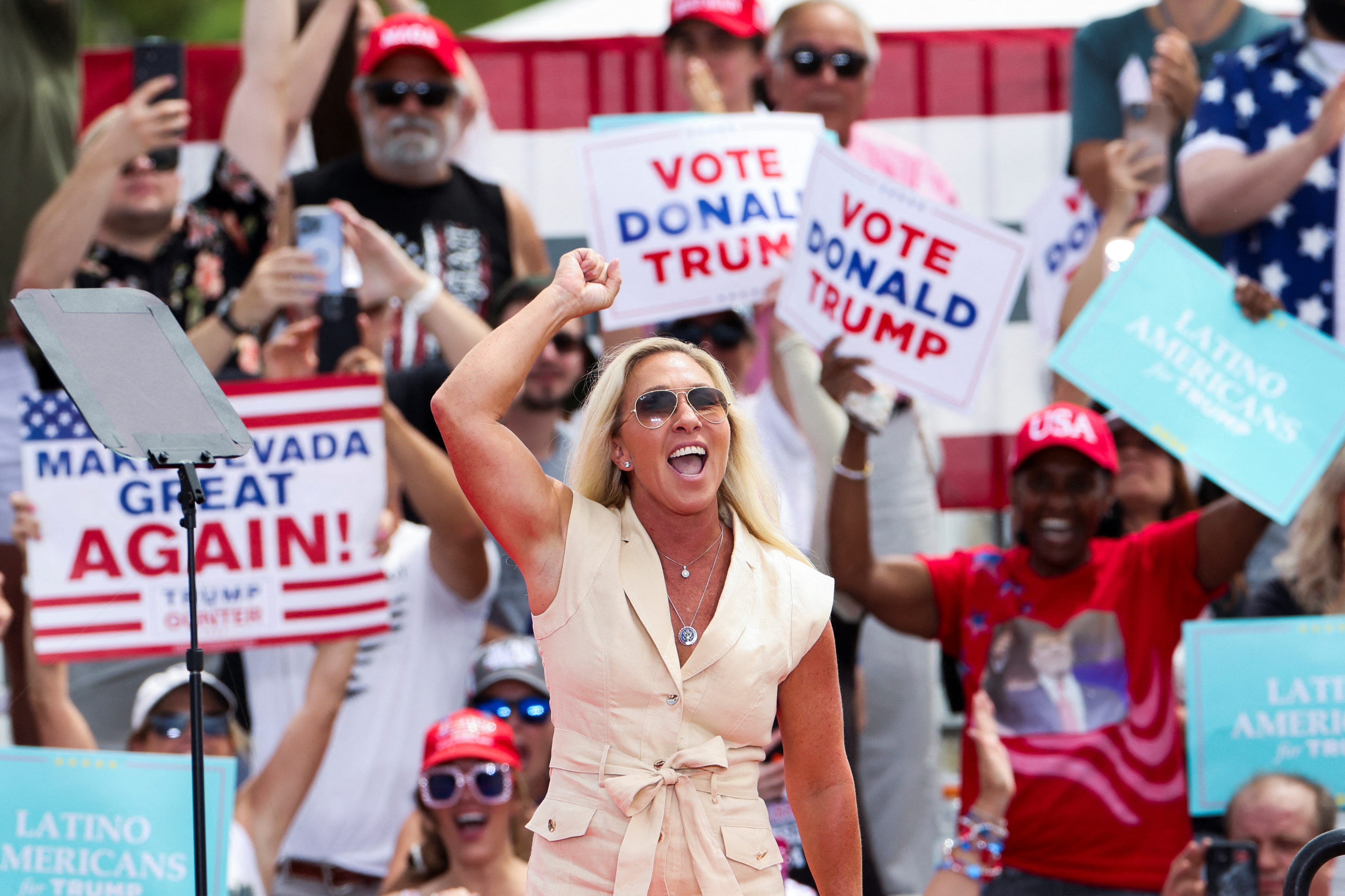 U.S. Rep. Marjorie Taylor Greene (R-GA) gestures as people wait for Republican presidential candidate and former U.S. President Donald Trump to attend a campaign event in Las Vegas, Nevada, U.S., June 9, 2024. REUTERS/Brendan McDermid