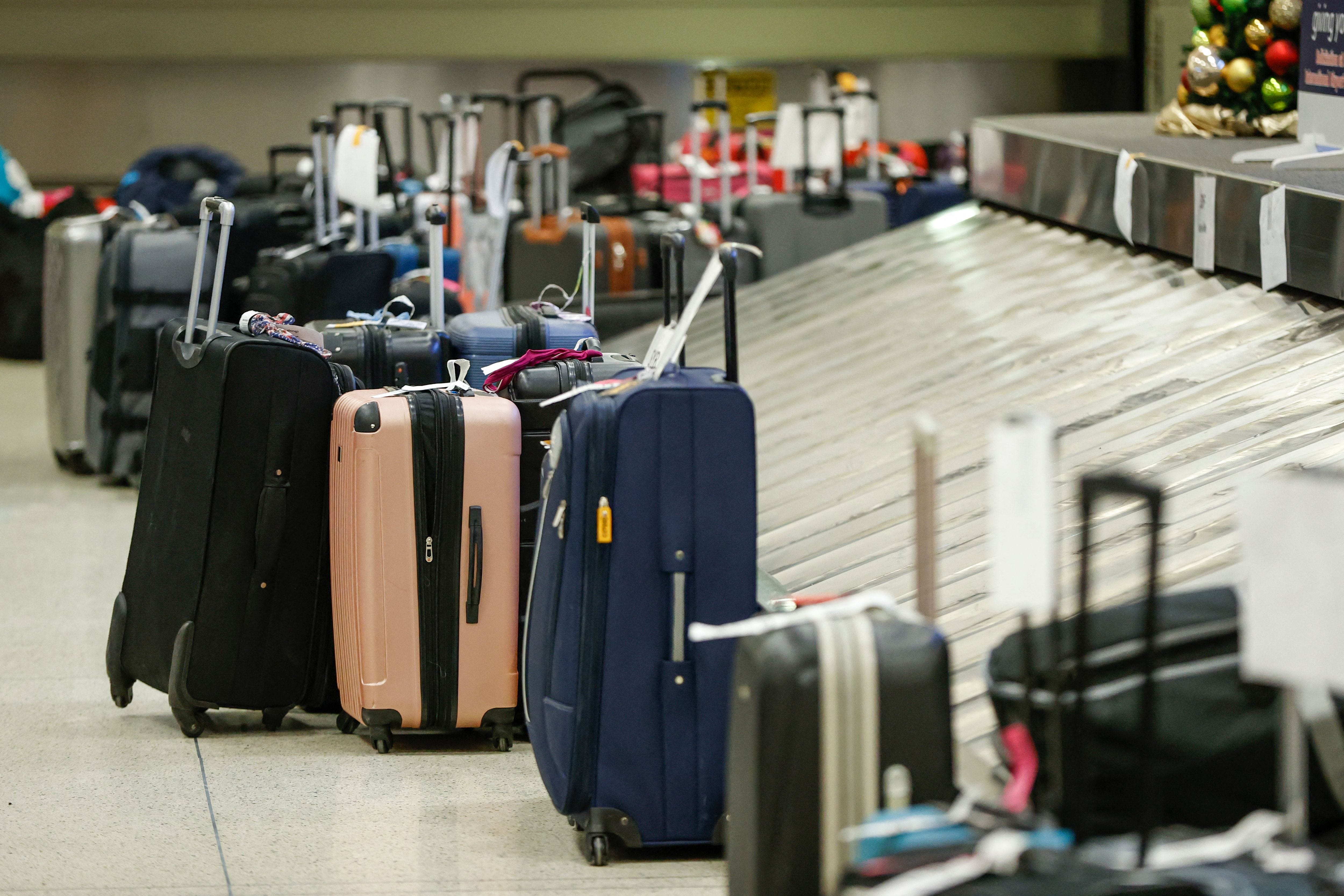 The luggage of Southwest Airlines passengers waits to be claimed in the baggage claim area at Chicago Midway International Airport in Chicago, Illinois, on December 28, 2022.
