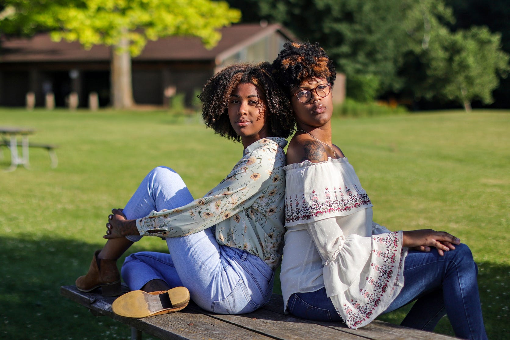 Macayla Jones, 24, Belleville, Mich. (right) and her sister Olivia Jones, 21, of Lansing, Mich. pose for a portrait at Island Area Recreation Area in Brighton, Mich. on Tuesday, June 11, 2024. The Jones' sisters, living in swing state Michigan, understand how their peer's votes could tip the scales in 2024 and although they dislike both Republican and Democratic presidential candidates, their fear of Trump has to overpower their hatred for   Biden.