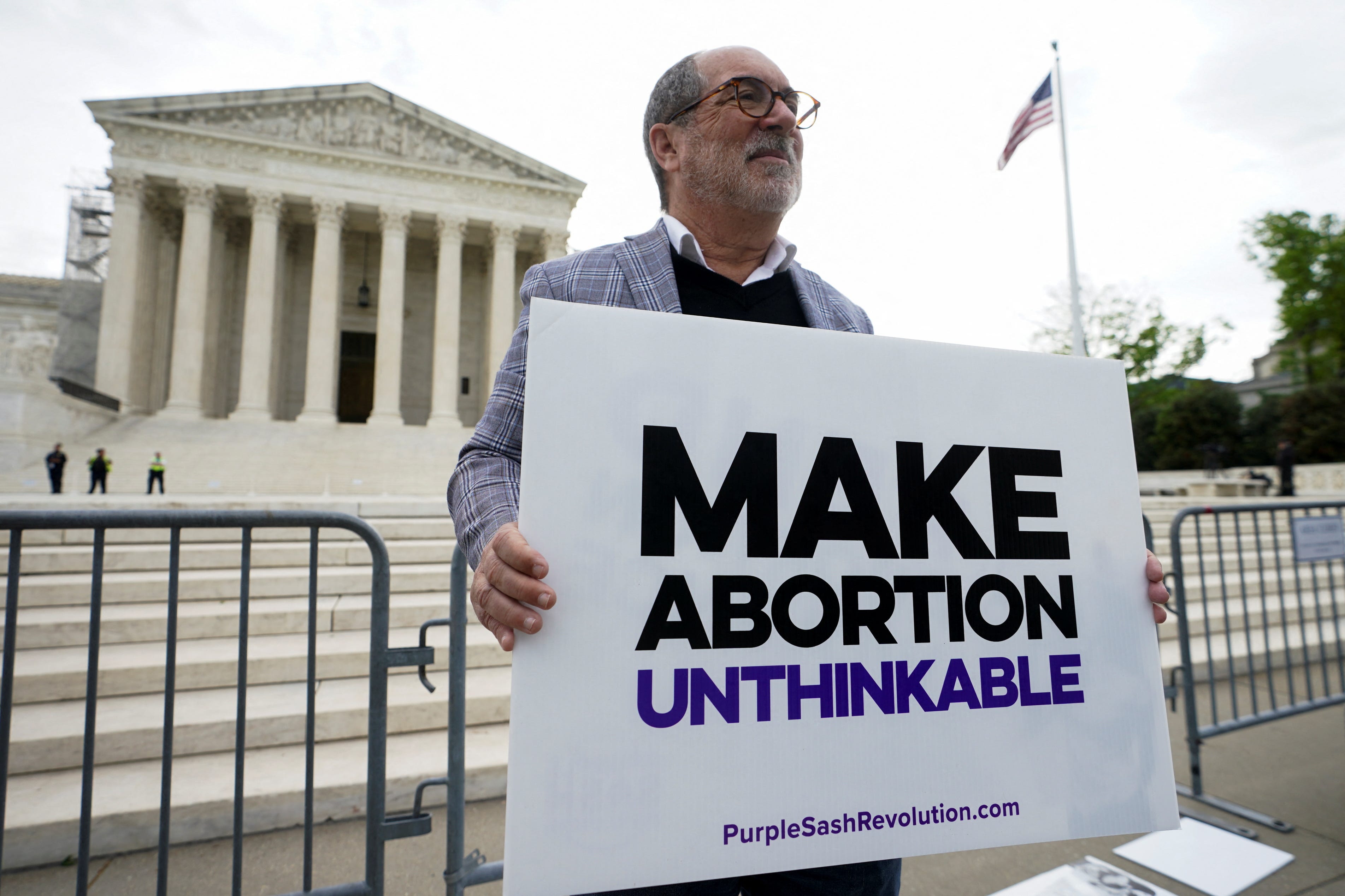 An anti-abortion activist protests at the Supreme Court on April 24, 2024.