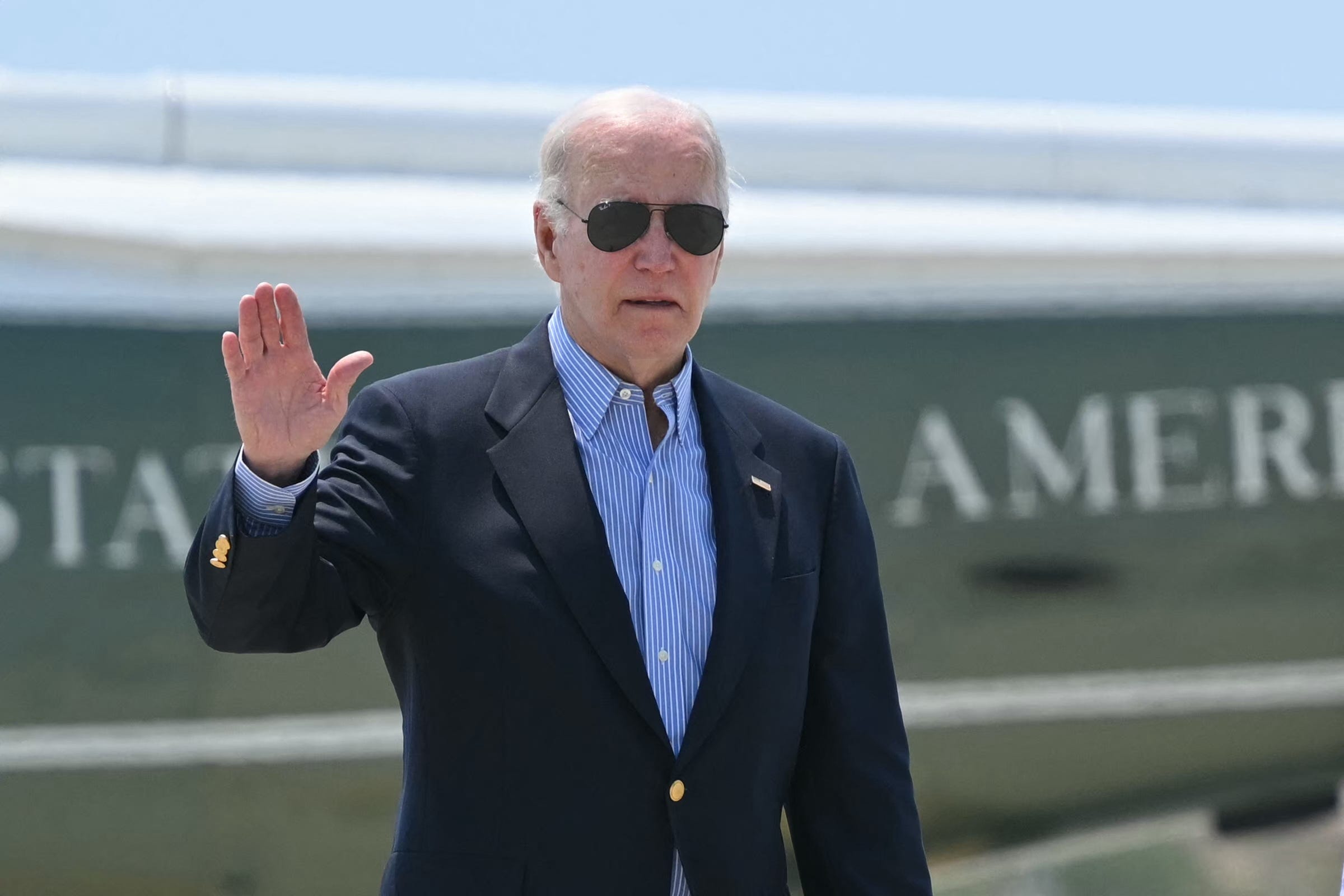 President Joe Biden is pictured stepping off Marine One to board Air Force One at Los Angeles International Airport.