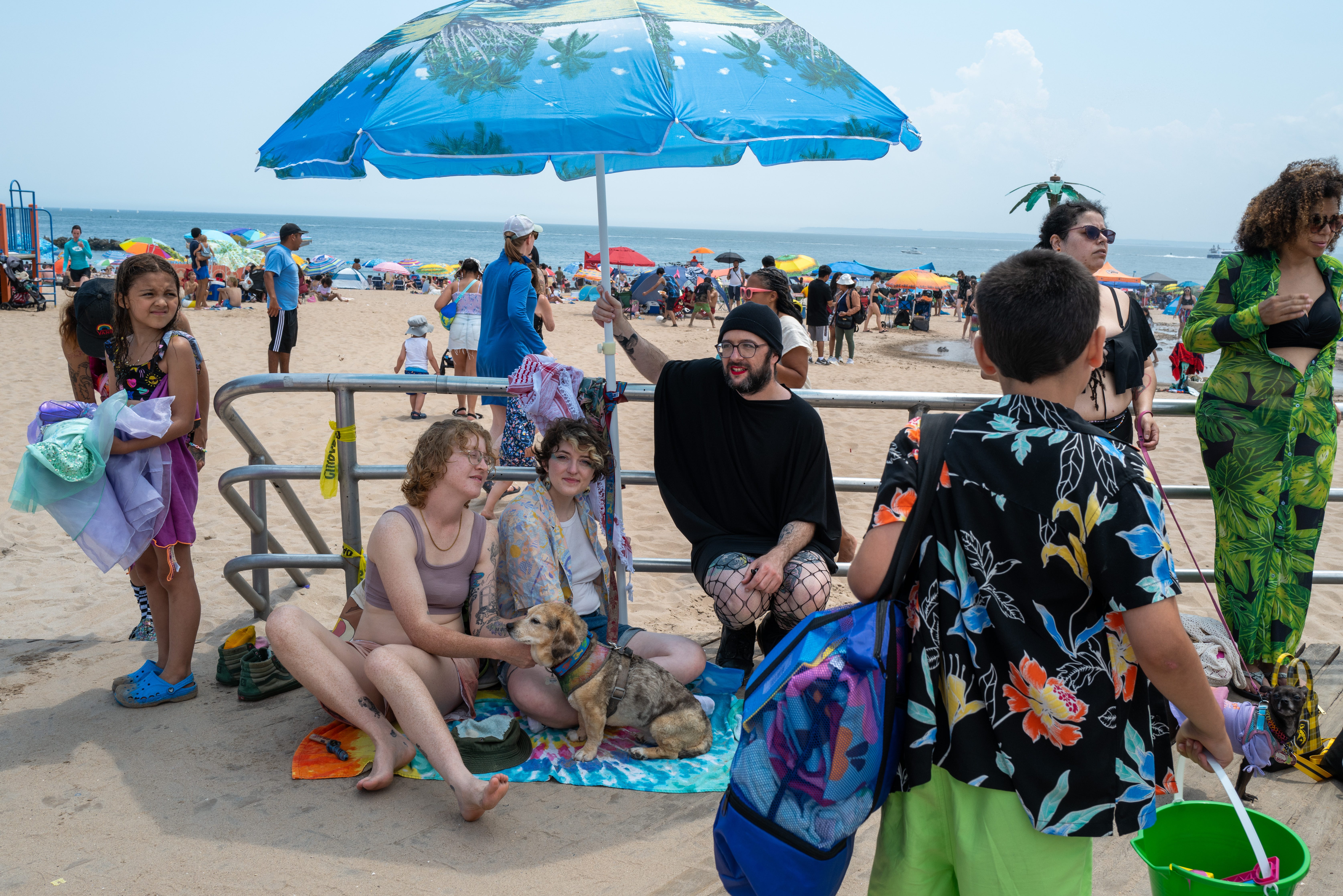 People visit the beach at Coney Island on June 22, 2024 in Brooklyn. Much of the Northeast is experiencing a heat wave causing the heat index to feel over 100 degrees.